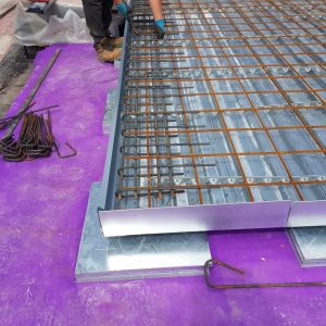 U Bars being installed around the perimeter of a rooftop floating floor